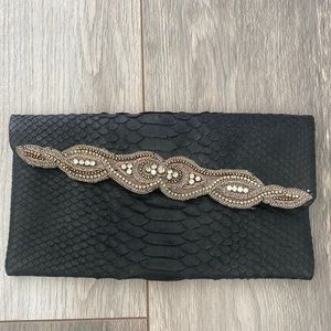 AMBRE BABZOE python clutch